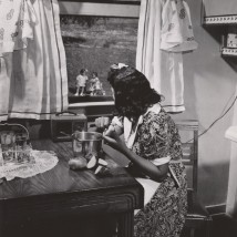 Anacostia, D.C. Frederick Douglass housing project. Mother watching her children as she prepares the evening meal, June 1942